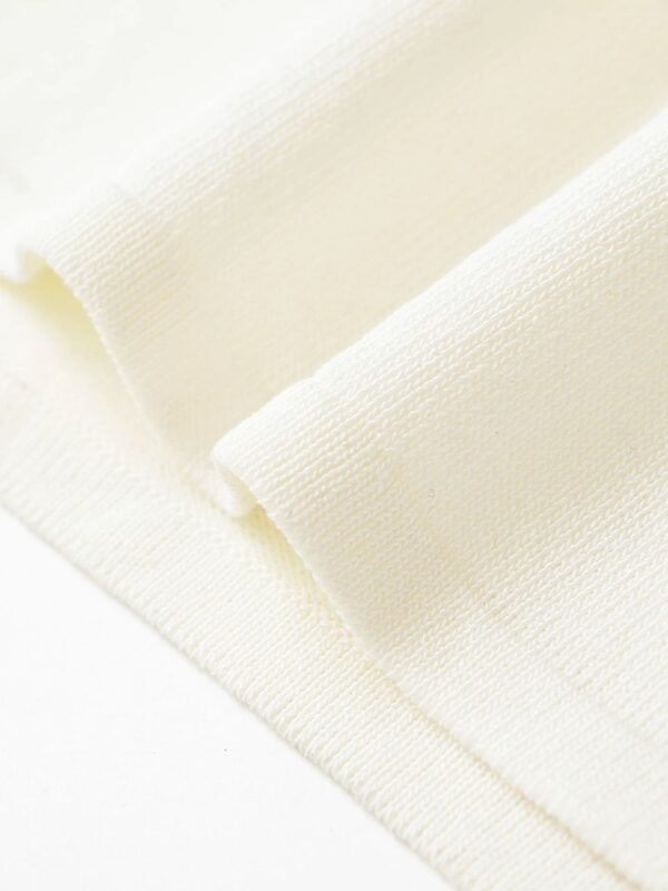 Halterneck Knit Dress With Gold Appliqué Black/White - Image 8
